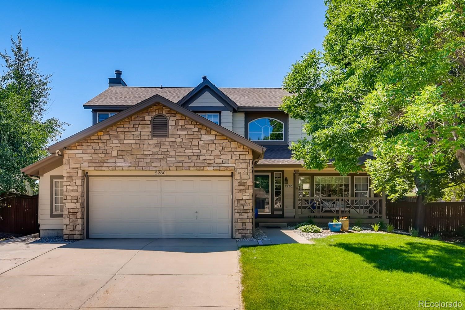 a front view of a house with yard
