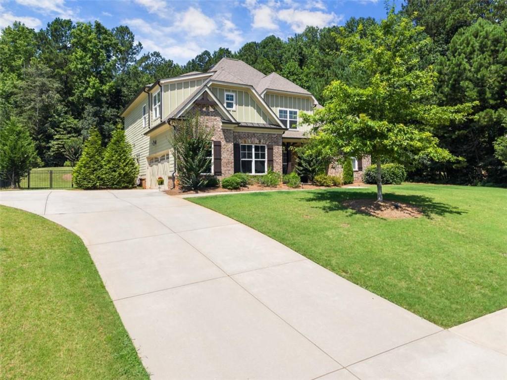 845 Walnut River Trail Hoschton, GA 30548 - Photo 11 of 74 a front view of a house with a yard
