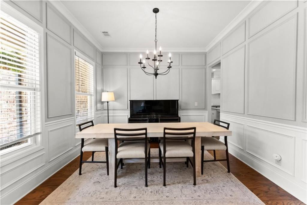 845 Walnut River Trail Hoschton, GA 30548 - Photo 13 of 74 a living room with furniture a table and a large window