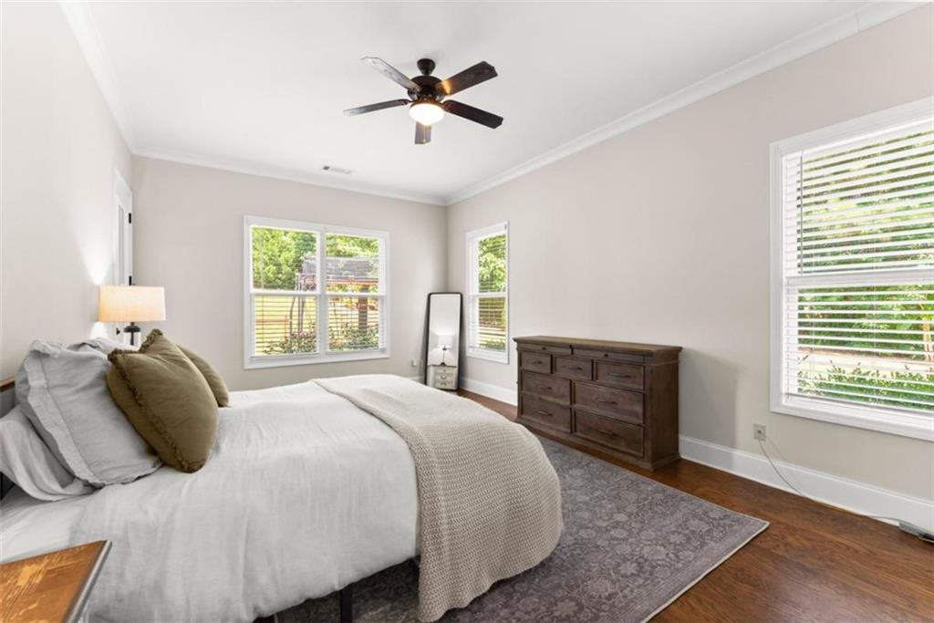 845 Walnut River Trail Hoschton, GA 30548 - Photo 15 of 74 a bedroom with a large bed and a window