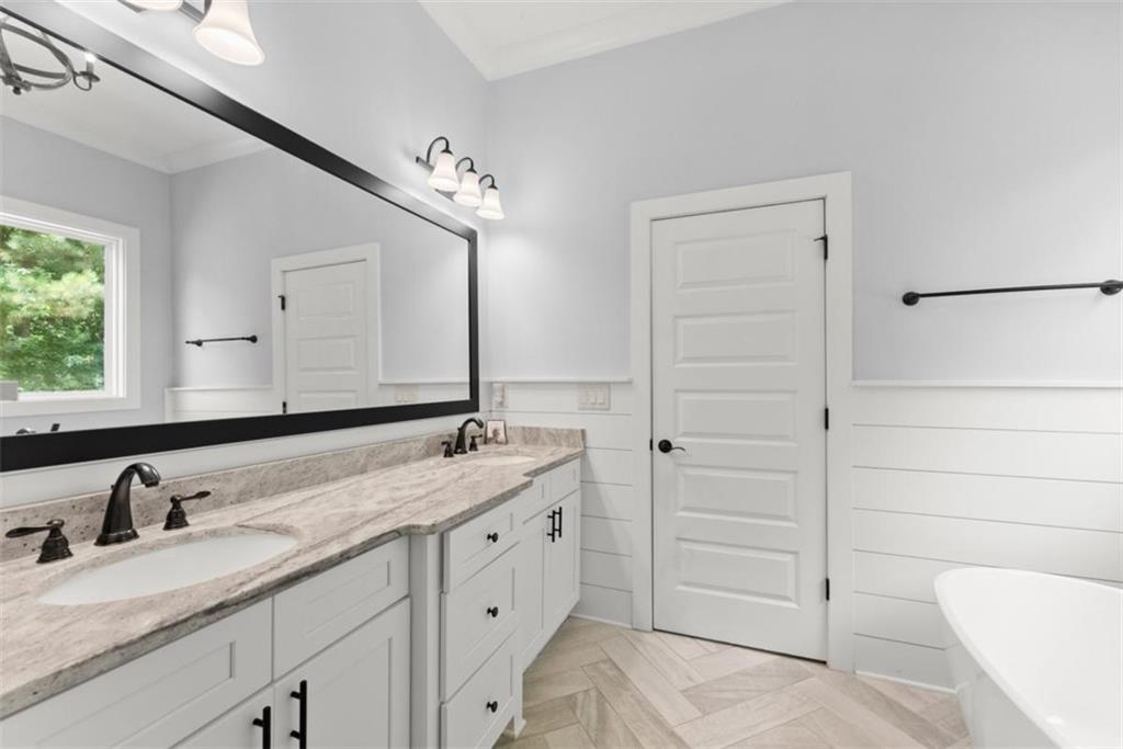 845 Walnut River Trail Hoschton, GA 30548 - Photo 20 of 74 a bathroom with a granite countertop sink and a mirror