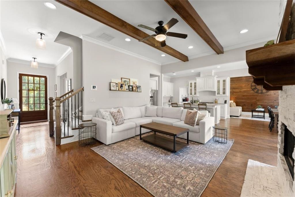 845 Walnut River Trail Hoschton, GA 30548 - Photo 23 of 74 a living room with furniture and a flat screen tv
