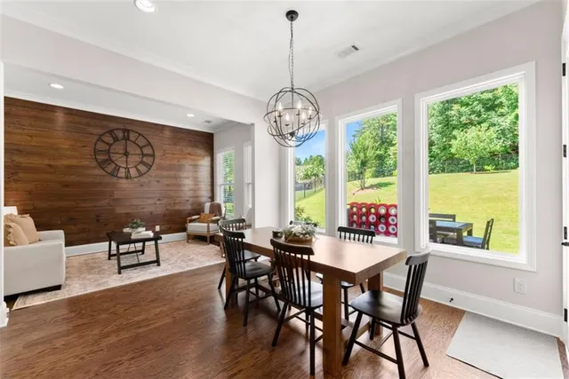a living room with furniture and a ceiling fan