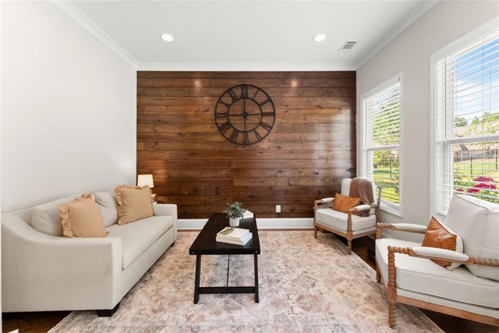845 Walnut River Trail Hoschton, GA 30548 - Photo 27 of 74 a living room with furniture and a large window