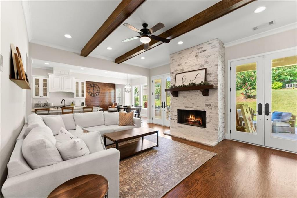 845 Walnut River Trail Hoschton, GA 30548 - Photo 3 of 74 a living room with furniture fireplace and flat screen tv