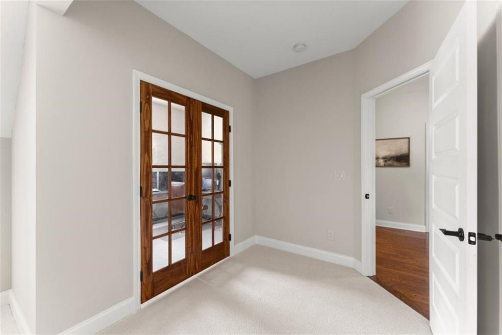 845 Walnut River Trail Hoschton, GA 30548 - Photo 39 of 74 an empty room with windows