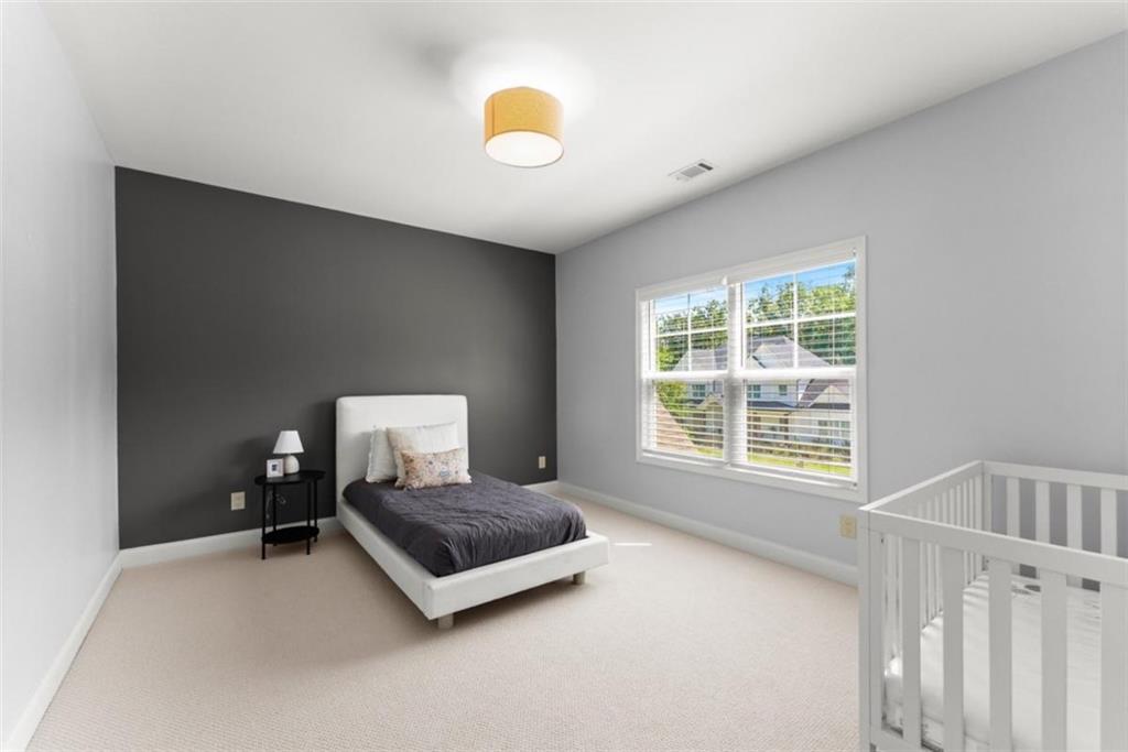 845 Walnut River Trail Hoschton, GA 30548 - Photo 40 of 74 a living room with a bed furniture and a window