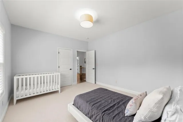 a view of a house with swimming pool and sitting area