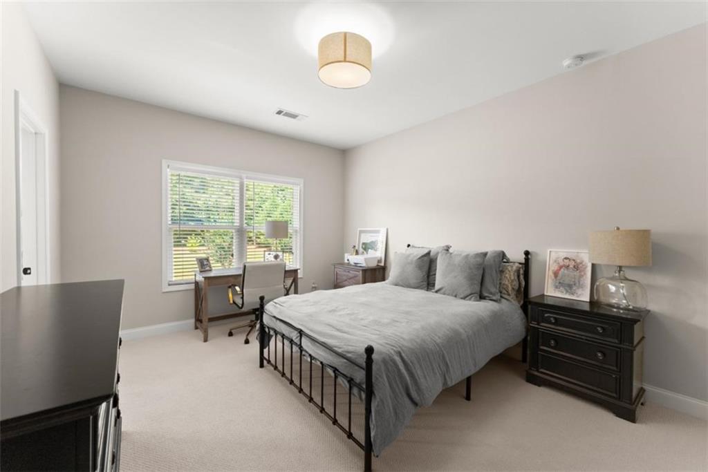 845 Walnut River Trail Hoschton, GA 30548 - Photo 45 of 74 a bedroom with a bed and a window