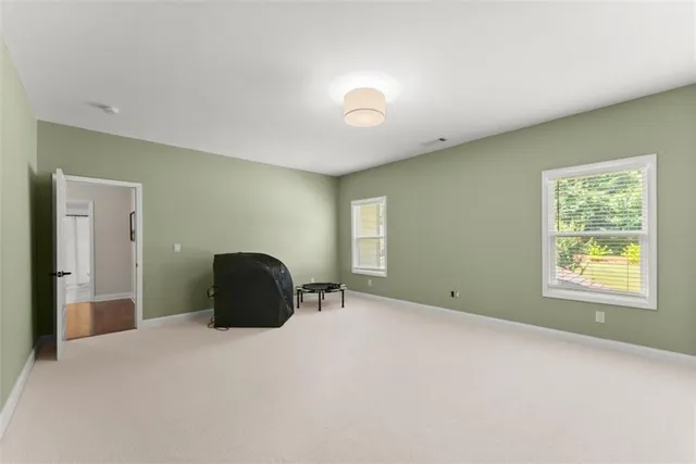 an aerial view of a house with garden space and street view