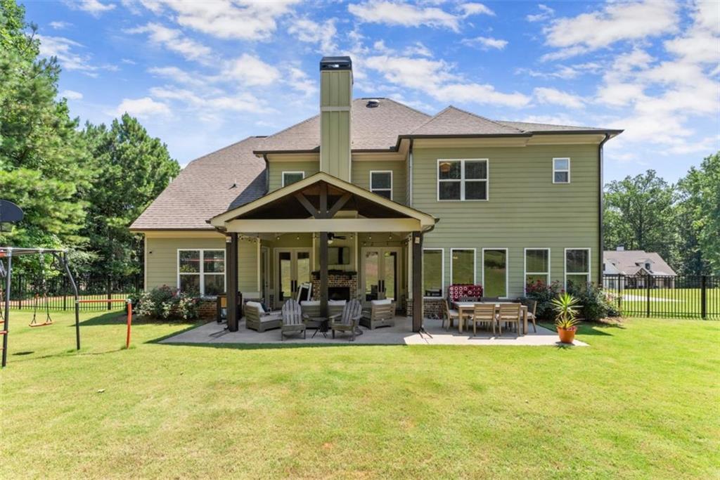 845 Walnut River Trail Hoschton, GA 30548 - Photo 56 of 74 a front view of a house with swimming pool