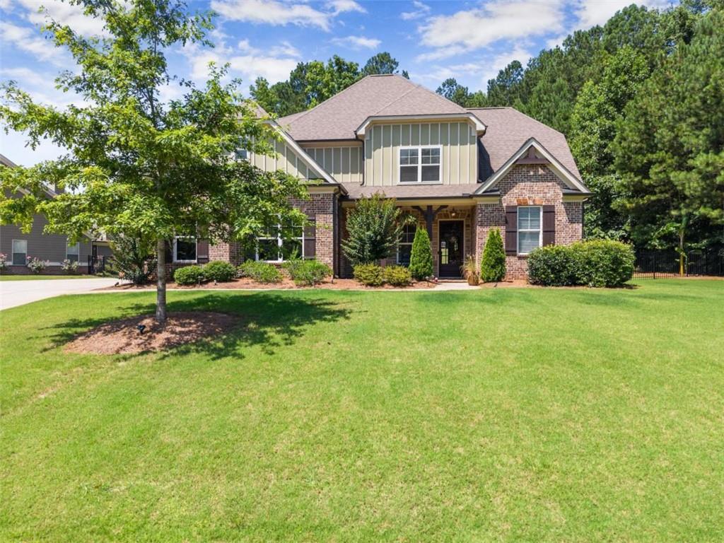 845 Walnut River Trail Hoschton, GA 30548 - Photo 10 of 74 a front view of a house with a yard