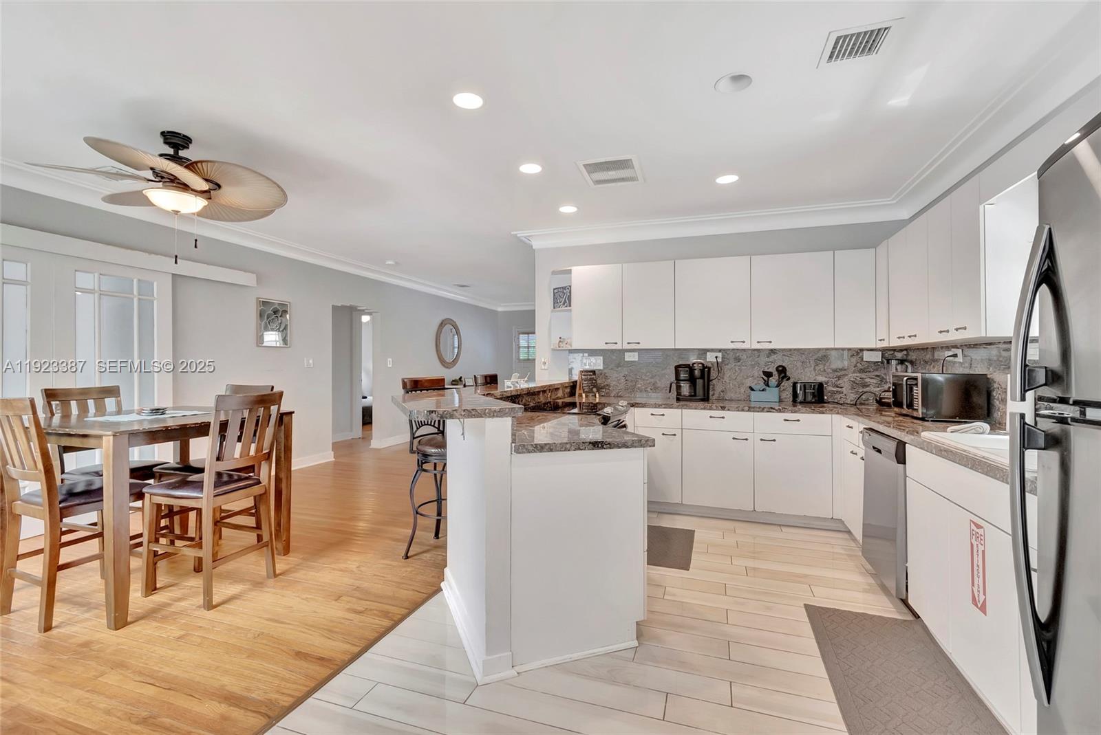 515 Southwest 9th Street Fort Lauderdale, FL 33315 - Photo 10 of 18 a kitchen with cabinets a sink and appliances