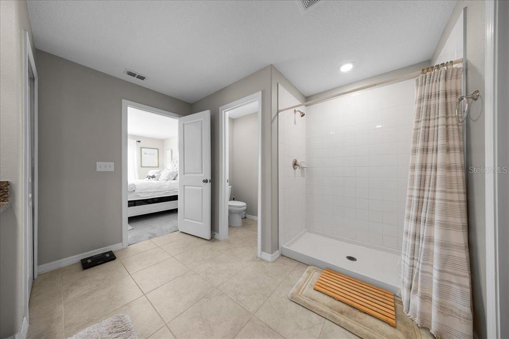 9329 Southwest 57th Terrace Ocala, FL 34476 - Photo 31 of 64 a bathroom with a shower and a sink