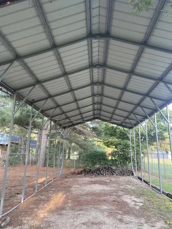 a view of a backyard with wooden floor
