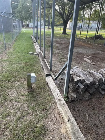 a view of a yard with swimming pool