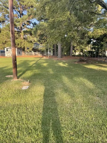 a view of yard with tree s