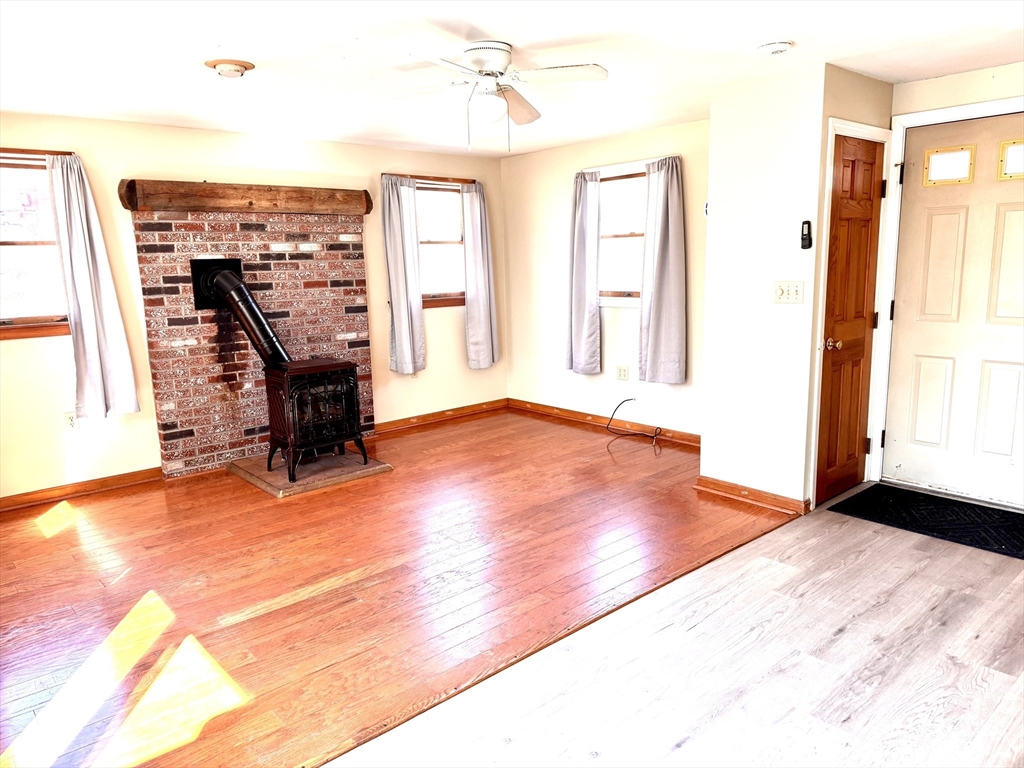 9 Redfield Road Cherry Valley, MA 01611 - Photo 12 of 35 a view of an empty room with window and a kitchen