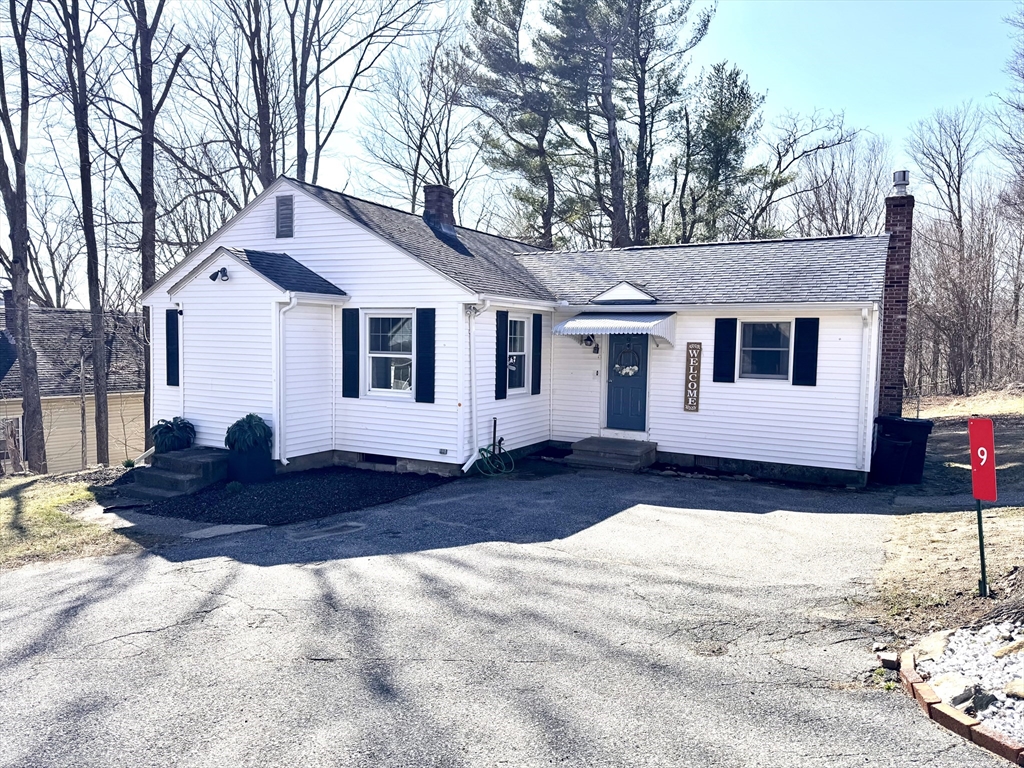 9 Redfield Road Cherry Valley, MA 01611 - Photo 2 of 35 a front view of a house with a yard