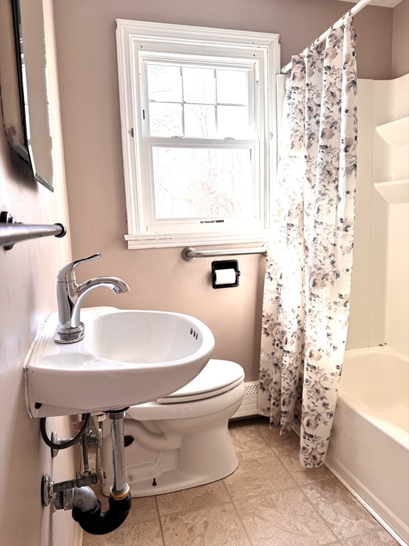 9 Redfield Road Cherry Valley, MA 01611 - Photo 27 of 35 a bathroom with a sink a toilet and a bathtub