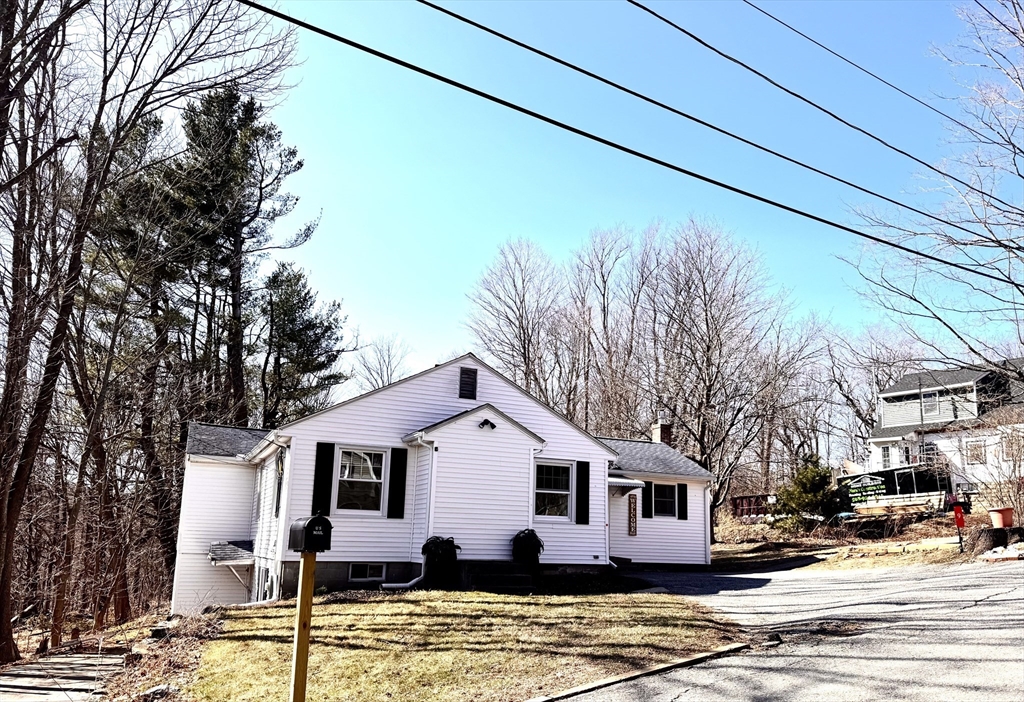 9 Redfield Road Cherry Valley, MA 01611 - Photo 3 of 35 a front view of a house with street