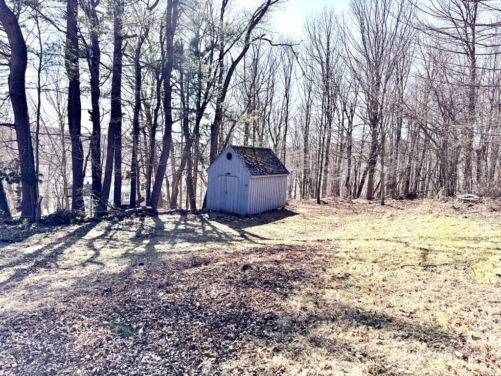 9 Redfield Road Cherry Valley, MA 01611 - Photo 33 of 35 a house with trees in front of it