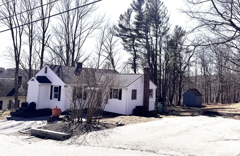 9 Redfield Road Cherry Valley, MA 01611 - Photo 35 of 35 a view of a house with a yard covered in snow