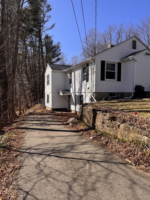 9 Redfield Road Cherry Valley, MA 01611 - Photo 4 of 35 a front view of a house with a yard