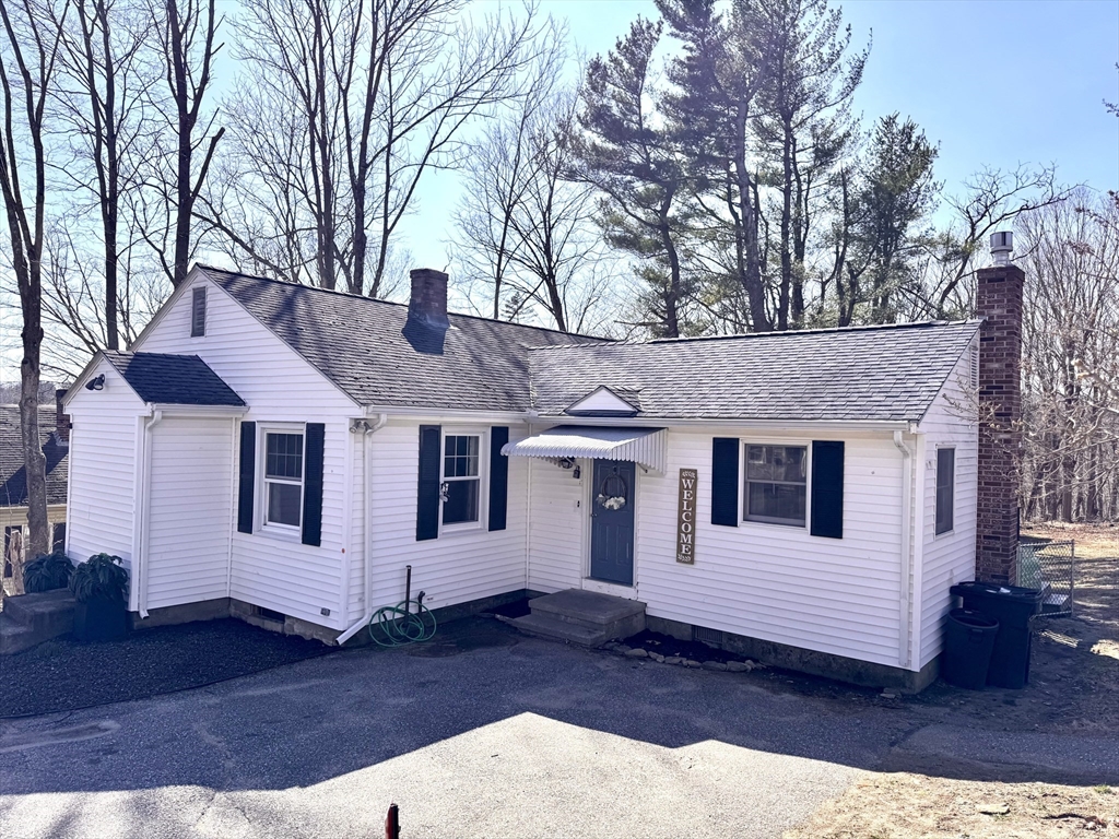 9 Redfield Road Cherry Valley, MA 01611 - Photo 5 of 35 a front view of a house with a yard