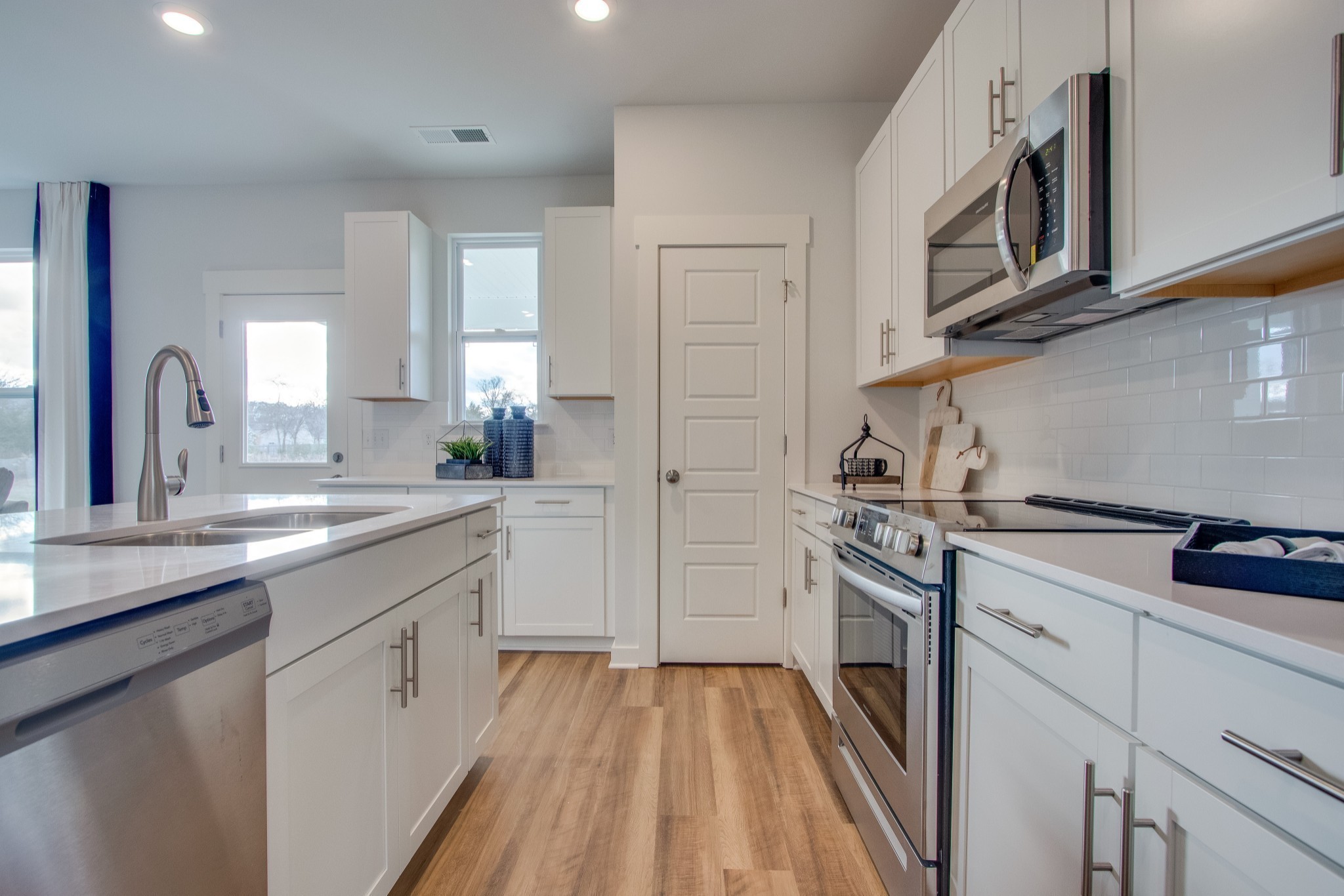 215 Goldfinch Rd Mount Mount Juliet, TN 37122 - Photo 5 of 18 a kitchen with stainless steel appliances granite countertop a stove a sink and a refrigerator