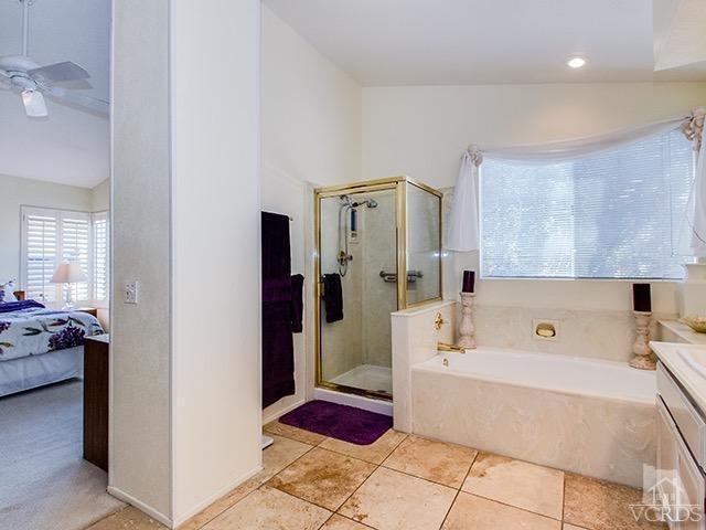 584 Fairfield Road Simi Valley, CA 93065 - Photo 15 of 26 a bathroom with a tub shower and sink