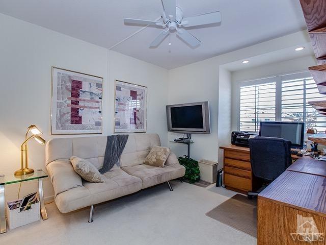 584 Fairfield Road Simi Valley, CA 93065 - Photo 17 of 26 a living room with furniture and a flat screen tv