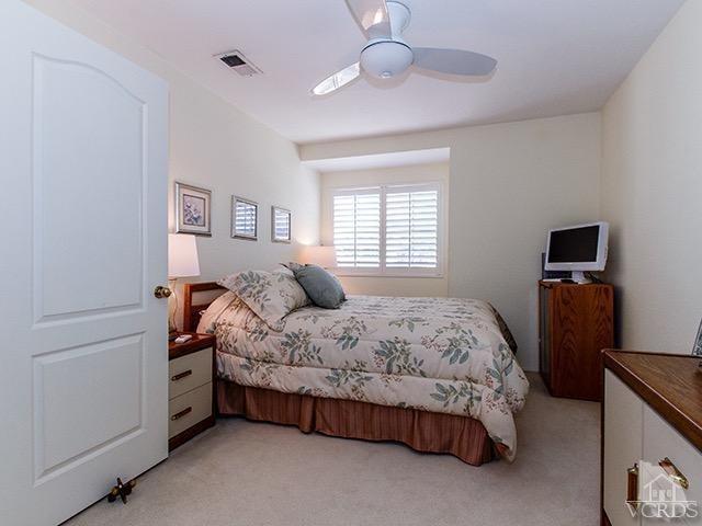 584 Fairfield Road Simi Valley, CA 93065 - Photo 19 of 26 a spacious bedroom with a bed and a tv