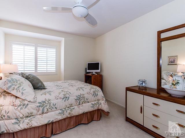 584 Fairfield Road Simi Valley, CA 93065 - Photo 20 of 26 a bedroom with a bed and a dresser in it