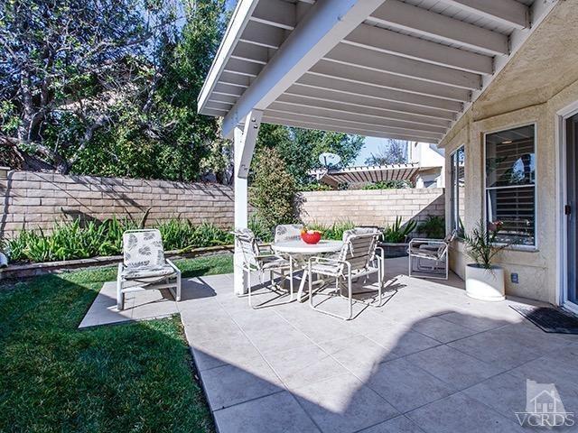 584 Fairfield Road Simi Valley, CA 93065 - Photo 23 of 26 a view of a patio with a table chairs and a backyard