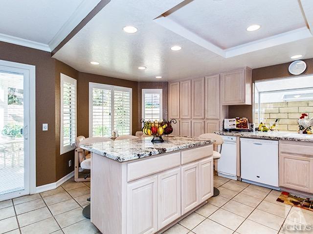 584 Fairfield Road Simi Valley, CA 93065 - Photo 8 of 26 a kitchen with stainless steel appliances granite countertop a stove sink and cabinets