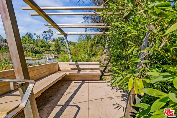 a view of a back yard from a balcony
