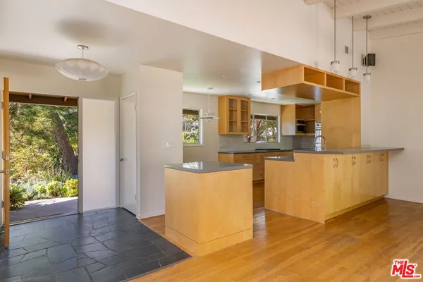 a view of kitchen with furniture and wooden floor