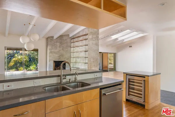 a kitchen with a sink and a window