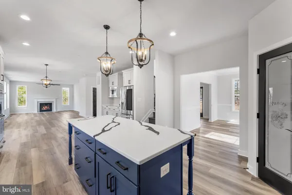 a kitchen with a sink stainless steel appliances and cabinets