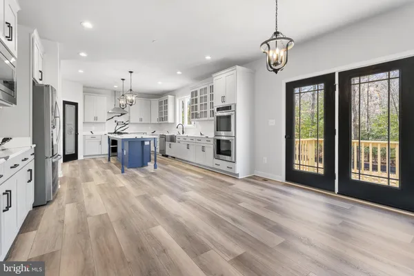 a view of livingroom with hardwood floor and a ceiling fan