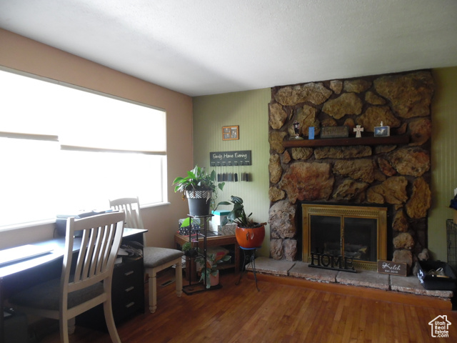 477 Grand Circle Moab, UT 84532 - Photo 19 of 22 Home office with wood finished floors and a fireplace