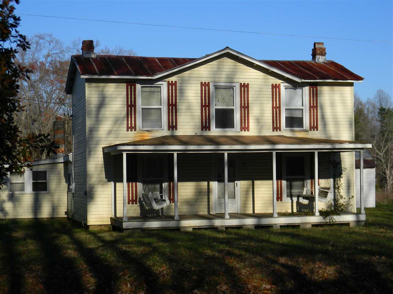 1838 square foot farmhouse sits on 10.616 beautiful acres just 8 miles from the town of Orange. Built in 1900,  the main roof is tin with composite shingles over the front porch.  There are many outbuildings.