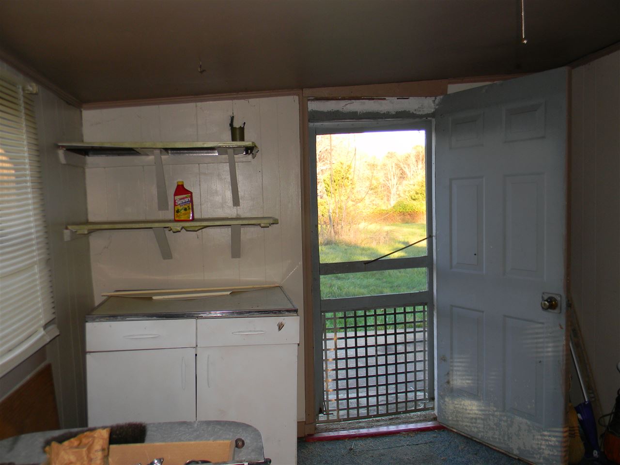 10063 Everona Road Unionville, VA 22567 - Photo 14 of 41 The other end of the dining room has built in shelving as well as the door.