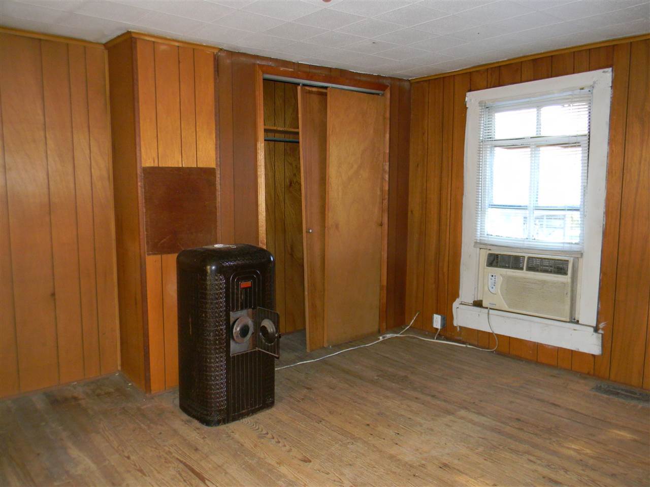 10063 Everona Road Unionville, VA 22567 - Photo 23 of 41 Heres one of the upstairs bedrooms. There is a heater in this room. The floors are the original hardwood.