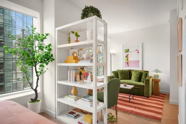a kitchen with granite countertop a stove and a microwave