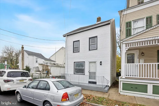 a front view of a house with parking space