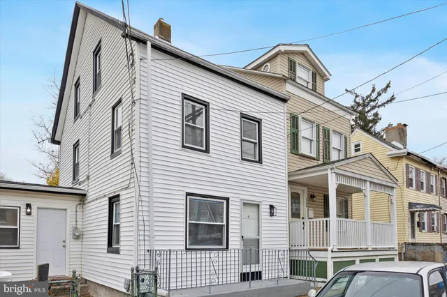 a view of a house with a street