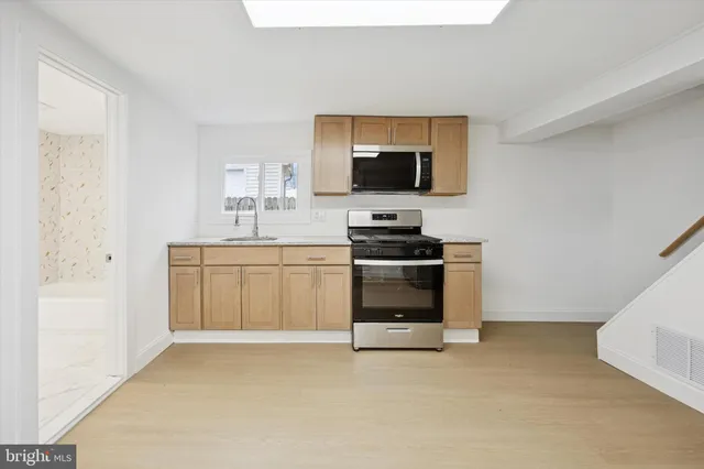 a kitchen with a stove and a microwave