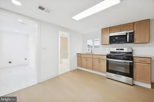 a kitchen with a stove and a microwave
